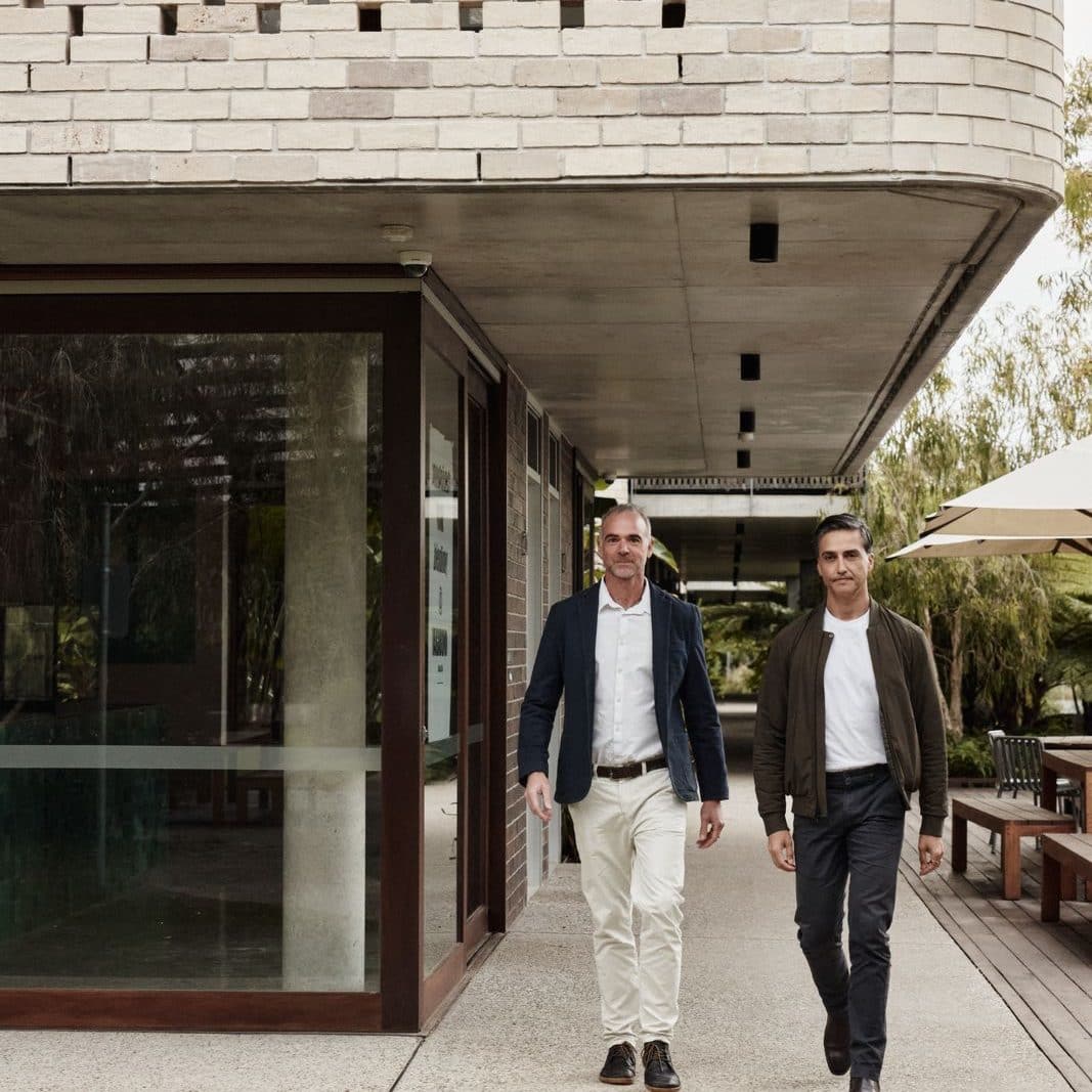Gabriel and Dane walking past the studio